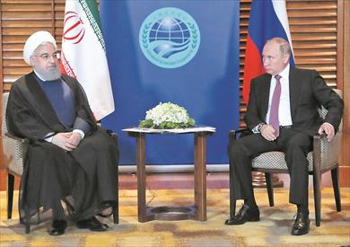 بوتين خلال لقاء مع نظيره الإيرانى حسن روحانى