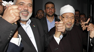 كان في استقبال القرضاوي رئيس حكومة حماس المقالة إسماعيل هنية