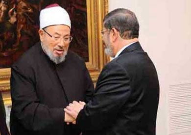 مرسي والقرضاوي