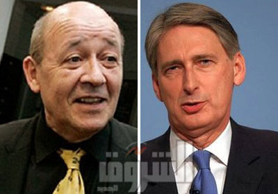 وزير الدفاع البريطاني فيليب هاموند ونظيره الفرنسي جان إيف لودريان
